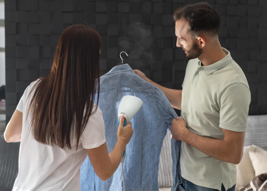 man-helping-his-wife-iron-shirt
